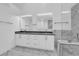 Sleek bathroom featuring a dual sink vanity, tile flooring and a soaking tub shower combination at 7368 Mission Hills Dr, Las Vegas, NV 89113