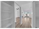Bright bedroom features modern wood floors, closet with sliding doors and a ceiling fan at 7368 Mission Hills Dr, Las Vegas, NV 89113