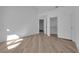 Clean bedroom with wood-style flooring and a closet with sliding doors at 7368 Mission Hills Dr, Las Vegas, NV 89113