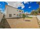 Spacious backyard featuring desert landscaping with green grass and a covered patio at 7464 Forestdale Ct, Las Vegas, NV 89120