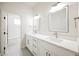 Bathroom featuring dual sinks, modern fixtures, and a separate shower area at 7464 Forestdale Ct, Las Vegas, NV 89120