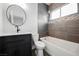 Modern bathroom featuring a vanity with dark wood cabinets and a shower over tub at 7464 Forestdale Ct, Las Vegas, NV 89120