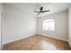 Bright bedroom with ceiling fan and a window providing natural light at 7464 Forestdale Ct, Las Vegas, NV 89120
