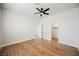 This bright bedroom features hard floors, ceiling fan, and walk-in closet with ensuite bathroom at 7464 Forestdale Ct, Las Vegas, NV 89120
