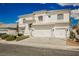 Beautiful two-story home with a three-car garage and manicured front yard landscaping at 7464 Forestdale Ct, Las Vegas, NV 89120