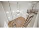High angle view of grand foyer with chandelier and staircase at 7464 Forestdale Ct, Las Vegas, NV 89120