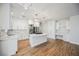 View of bright, open kitchen with stainless steel appliances, white cabinets, and center island at 7464 Forestdale Ct, Las Vegas, NV 89120