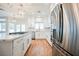 View of open kitchen featuring stainless steel appliances, a gas cooktop, and quartz countertops at 7464 Forestdale Ct, Las Vegas, NV 89120