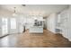 Bright, open kitchen with stainless steel appliances, white cabinets, and center island with a gas cooktop at 7464 Forestdale Ct, Las Vegas, NV 89120