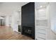 Elegant fireplace with tile surround, built-in bar and wine fridge in living area at 7464 Forestdale Ct, Las Vegas, NV 89120
