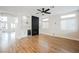 Living room featuring a fireplace, modern fixtures, and wood-look flooring at 7464 Forestdale Ct, Las Vegas, NV 89120