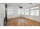 View of the open-concept living area, featuring wood-look floors and modern finishes at 7464 Forestdale Ct, Las Vegas, NV 89120