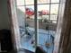 View from the dining room window to the relaxing balcony with comfortable seating at 7665 Calico Fields St, Las Vegas, NV 89149