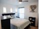 Bright bedroom featuring a comfortable bed, ceiling fan, and serene decor at 7665 Calico Fields St, Las Vegas, NV 89149
