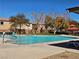 Inviting community pool area with lounge chairs and well-maintained landscaping at 7665 Calico Fields St, Las Vegas, NV 89149