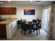 Cozy dining area featuring modern decor, a round table with seating, and sliding doors for natural light at 7665 Calico Fields St, Las Vegas, NV 89149