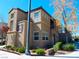 Attractive stucco home with a balcony, showcasing well-maintained landscaping and architectural details at 7665 Calico Fields St, Las Vegas, NV 89149