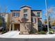 Inviting two-story home with a garage and well-manicured front yard, set against a bright blue sky at 7665 Calico Fields St, Las Vegas, NV 89149
