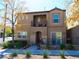Charming two-story home with a balcony, landscaped yard, and inviting curb appeal in a residential neighborhood at 7665 Calico Fields St, Las Vegas, NV 89149