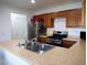 The kitchen showcases wooden cabinets, stainless steel appliances, and ample counter space at 7665 Calico Fields St, Las Vegas, NV 89149