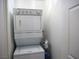 Efficient laundry featuring stacked washer and dryer and storage solutions at 7665 Calico Fields St, Las Vegas, NV 89149