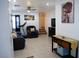 Cozy living room with tiled floor, comfortable seating, and modern decor at 7665 Calico Fields St, Las Vegas, NV 89149