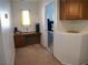 Small office space with built-in desk and access to another room via safety gate at 7665 Calico Fields St, Las Vegas, NV 89149