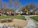 Beautiful community park with playground, walking path, and lush green spaces for outdoor activities and relaxation at 7665 Calico Fields St, Las Vegas, NV 89149