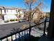 View of the street from the balcony of this charming two-story home with well-maintained landscaping at 7665 Calico Fields St, Las Vegas, NV 89149