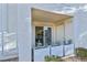 Cozy balcony with plants overlooking the interior of the home through the sliding glass door at 7904 Fossil Creek Ln # 101, Las Vegas, NV 89145