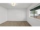 Bright bedroom featuring vinyl floors and large window at 7904 Fossil Creek Ln # 101, Las Vegas, NV 89145