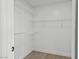 Spacious walk-in closet with ample shelving, providing plenty of room for storage and organization at 7904 Fossil Creek Ln # 101, Las Vegas, NV 89145