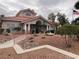 Exterior view of the community clubhouse featuring well-maintained landscaping at 7904 Fossil Creek Ln # 101, Las Vegas, NV 89145