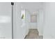 Clean and modern hallway featuring built-in storage and fresh white paint at 7904 Fossil Creek Ln # 101, Las Vegas, NV 89145