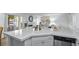 Well-equipped kitchen with quartz countertops, stainless steel appliances, and ample counter space at 7904 Fossil Creek Ln # 101, Las Vegas, NV 89145