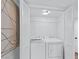 Convenient laundry closet with a white washer and dryer at 7904 Fossil Creek Ln # 101, Las Vegas, NV 89145
