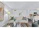Comfortable living room with sofa, modern decor, and open access to the kitchen at 7904 Fossil Creek Ln # 101, Las Vegas, NV 89145
