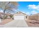 Charming single-story home with a two car garage, beautiful landscaping, and a well-maintained exterior at 8468 W Gilmore Ave, Las Vegas, NV 89129