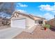 Charming single-story home features a well-manicured yard and a two-car garage, enhancing curb appeal at 8468 W Gilmore Ave, Las Vegas, NV 89129