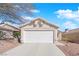 Beautiful single-story home with two car garage, and desert landscaping providing a welcoming curb appeal at 8468 W Gilmore Ave, Las Vegas, NV 89129