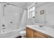 Bathroom with shower and tub, neutral color scheme and hardwood floors at 8932 Jaquita Ave, Las Vegas, NV 89149