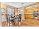 Dining area featuring hardwood floors and an archway to a kitchen at 8932 Jaquita Ave, Las Vegas, NV 89149