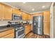 Modern kitchen with stainless steel appliances, including a refrigerator, oven, and microwave at 8932 Jaquita Ave, Las Vegas, NV 89149