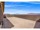 Fenced backyard with views of the mountains in the distance at 10186 Zeta Tucana St, Las Vegas, NV 89143