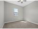 Neutral bedroom offers a cozy carpet, a window that provides natural light, and space to relax at 10186 Zeta Tucana St, Las Vegas, NV 89143