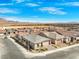New homes in a Primary-planned community boast desert landscaping and mountain views under a bright blue sky at 10186 Zeta Tucana St, Las Vegas, NV 89143
