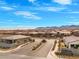 Neighborhood view including the front gate and landscaping in the front at 10186 Zeta Tucana St, Las Vegas, NV 89143