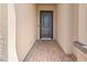 Covered entryway with tiled flooring and neutral paint at 10186 Zeta Tucana St, Las Vegas, NV 89143