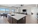 Open kitchen featuring a large island, modern appliances, and easy access to the living area at 10186 Zeta Tucana St, Las Vegas, NV 89143