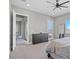 Spacious main bedroom with a gray dresser, ceiling fan, and carpet floors at 10186 Zeta Tucana St, Las Vegas, NV 89143